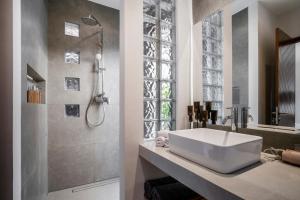 a bathroom with a sink and a shower at Villa Hammock by BaliSuperHost in Ubud