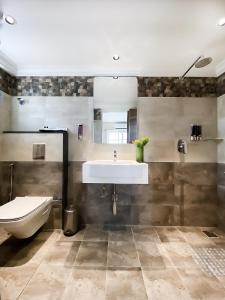 a bathroom with a sink and a toilet at Click Hotel Biz, Bangalore International Airport in Yelahanka