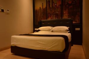 Postel nebo postele na pokoji v ubytování Manhattan Business Hotel TTDI