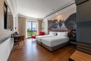 Postel nebo postele na pokoji v ubytování Travelodge Ipoh