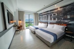 Postel nebo postele na pokoji v ubytování Travelodge Ipoh