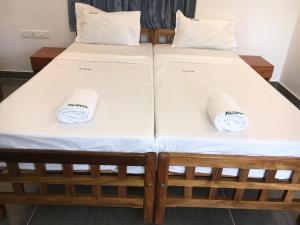 Postel nebo postele na pokoji v ubytování Aloha Homestay