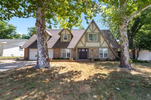 a house with two trees in the yard at Close to St. Francis Hospital • 4 Smart Tvs • Pool • Patio in Tulsa