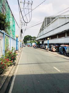 an empty street with cars parked on the side of a building at THE MANSION - 2 PAX SOLO BUDGET Room near AIRPORT TERMINAL in Manila