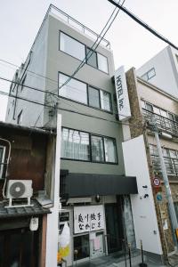 a building with writing on the side of it at HOTEL Inc in Kyoto