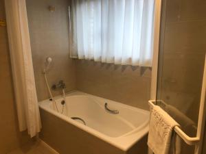 Koupelna v ubytování Doitsu Hotel