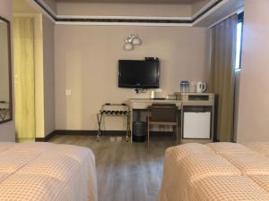 Postel nebo postele na pokoji v ubytování Doitsu Hotel