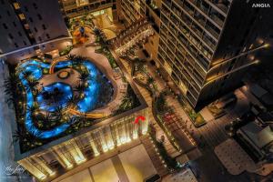 an overhead view of a pool in a city at night at BIG SALE 33percent The Song An Gia Vung Tau - Luxury 2Beds Apartment in Vung Tau