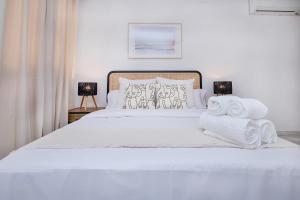 Posteľ alebo postele v izbe v ubytovaní San Rafael City Center Apartment