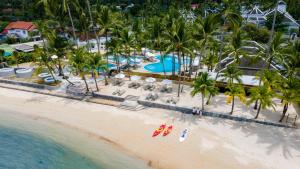 an aerial view of a resort on the beach at Outrigger Koh Samui Beach Resort - SHA Extra Plus in Lamai +37 photos