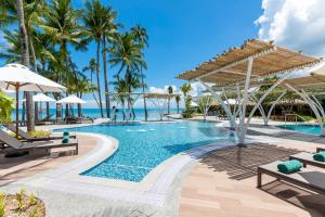 a pool at the excellence punta cana resort at Outrigger Koh Samui Beach Resort - SHA Extra Plus in Lamai