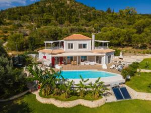 an aerial view of a house with a swimming pool at Villa Socrates in Skala