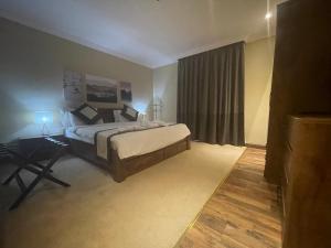 Ένα ή περισσότερα κρεβάτια σε δωμάτιο στο Wakra Inn Hotel Apartments