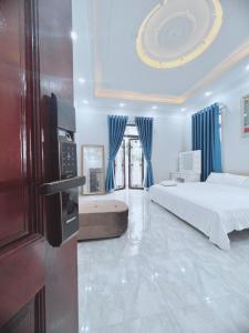 Ένα ή περισσότερα κρεβάτια σε δωμάτιο στο Villa Blueware - Venuestay