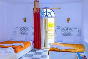 Postel nebo postele na pokoji v ubytování Onaty Ka Guest House