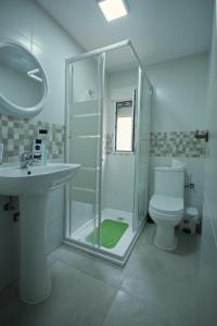 a bathroom with a shower and a toilet and a sink at Apartamento in Almería
