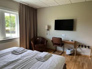 TV a/nebo společenská místnost v ubytování Ombergs Golf Resort