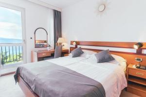 Posteľ alebo postele v izbe v ubytovaní Hotel Horizont