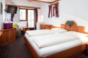 Posteľ alebo postele v izbe v ubytovaní Hotel Gabriela