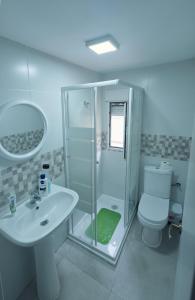 a bathroom with a shower and a sink and a toilet at Apartamento in Almería