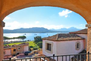 a view of the water from a building at villa fronte mare in Cannigione +18 photos