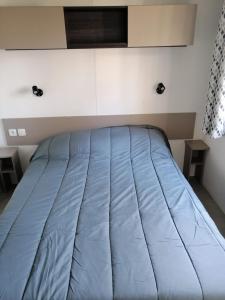 Ένα ή περισσότερα κρεβάτια σε δωμάτιο στο Mobilhome 6/8 personnes Piriac sur Mer +22 φωτογραφίες