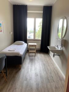 Postel nebo postele na pokoji v ubytování Sidsjö Hotell & Konferens