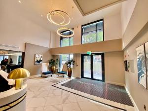 a lobby with a swimming pool in a building at St Martin's Place 2 Bed Bham City with free parking in Birmingham