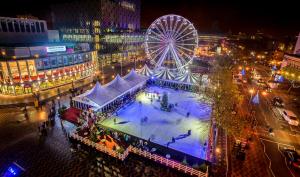 a city at night with a ferris wheel at St Martin's Place 2 Bed Bham City with free parking in Birmingham