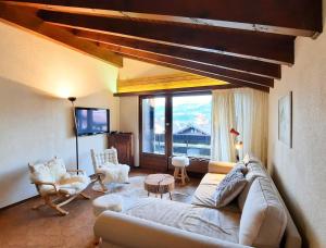 Posezení v ubytování Charmant appartement au coeur de Vercorin + 15 fotografií