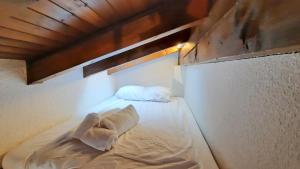 Postel nebo postele na pokoji v ubytování Charmant appartement au coeur de Vercorin