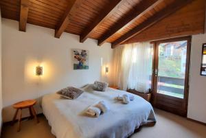 Postel nebo postele na pokoji v ubytování Charmant appartement au coeur de Vercorin