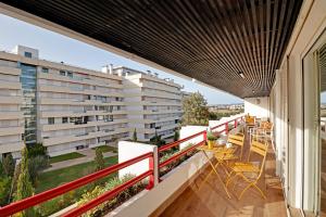 a balcony with a view of a building at Home Out Vilamoura 20 Levante in Vilamoura