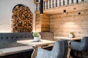 a dining room with two tables and chairs at Hotel Antoniushof in Ruhstorf