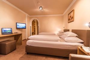 Postelja oz. postelje v sobi nastanitve Hotel Garni Apart TINA