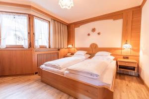 Postelja oz. postelje v sobi nastanitve Hotel Garni Apart TINA