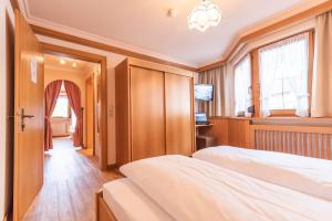 Postelja oz. postelje v sobi nastanitve Hotel Garni Apart TINA