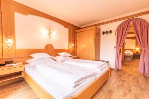 Postelja oz. postelje v sobi nastanitve Hotel Garni Apart TINA