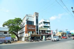 a busy city street with cars driving down a street at HOTEL KING PARK in Puducherry