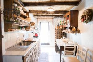 a kitchen with a sink and a table at Freelandros Villa in Nardodipace