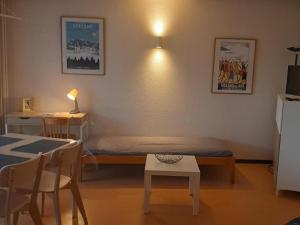 a small room with a bed and a table at Appartement Villard-de-Lans, 2 pièces, 6 personnes - FR-1-515-3 in Villard-de-Lans