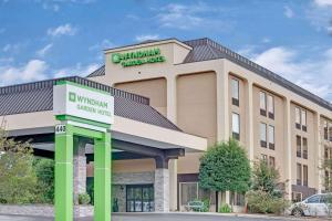 a rendering of a holiday inn express hotel at Wyndham Garden Charlotte Airport Southeast in Charlotte