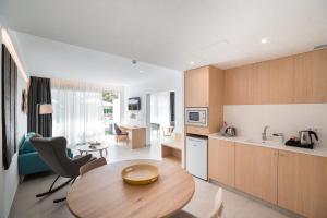 A kitchen or kitchenette at Petit Sagitario Adults only