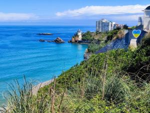 a view of the ocean from a bluff at SURF HOSTEL BIARRITZ in Biarritz