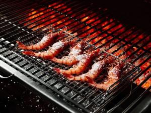 a group of shrimp cooking on a grill at The Swan Inn in Highpeak Junction