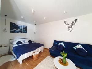 Posteľ alebo postele v izbe v ubytovaní Apartamenty Waligóra