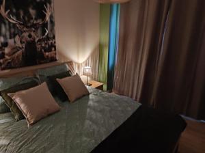En eller flere senge i et værelse på Gîte La Renéade
