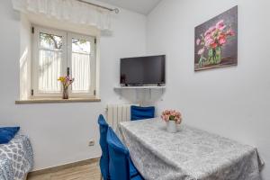TV a/nebo společenská místnost v ubytování Haus Diana