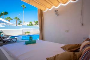 Postel nebo postele na pokoji v ubytování Haciendas Village Tenerife + 37 fotografií