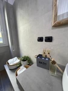a bathroom with a counter top with a table with a sidx sidx sidx at MADE in Bologna in Bologna